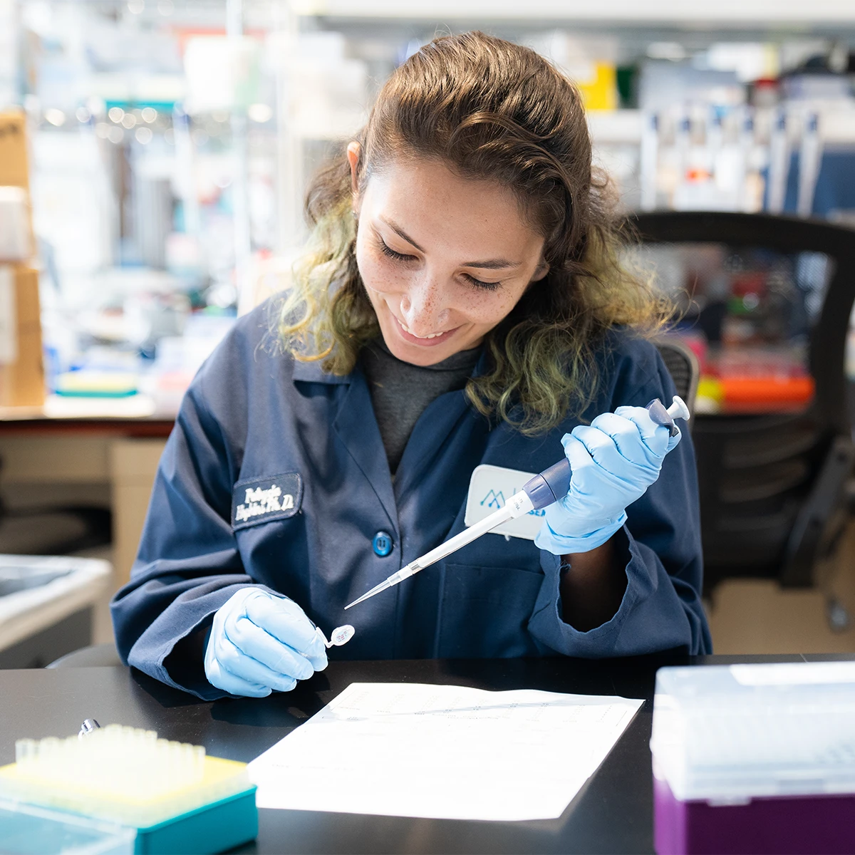 Molecular Assemblies Lab Employee with Sample